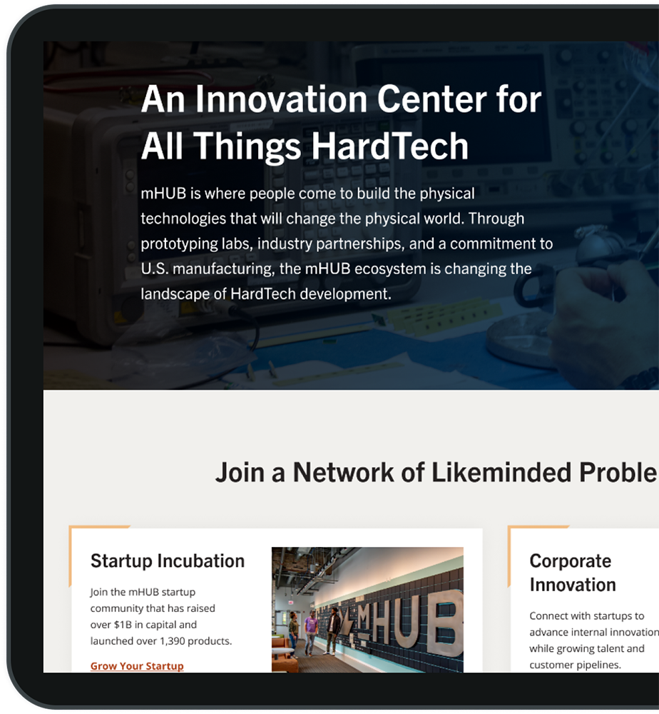 Tablet mockup of the mHUB website homepage.